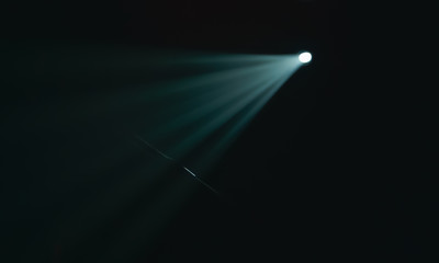 Closeup of concert light beam at empty stage