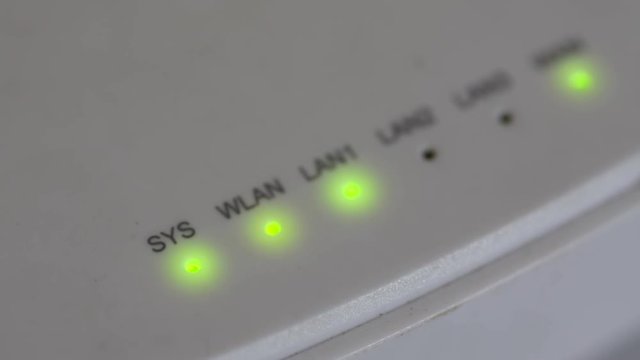 Modem router server LED lights, closeup, green lights, white color, loopable