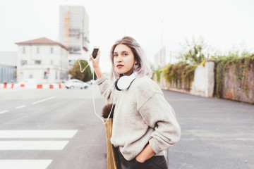 young woman beautiful outdoor looking over asking taxi - car pooling, hitch hiking, car sharing...