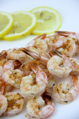 seafood. shrimp on a plate with lemon.