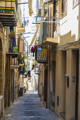 Fototapeta na wymiar Street of the old town of Cefalu in Sicily, Italy