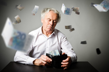 Old man in white and wallet with twenty Euro. Accounting and taxes.