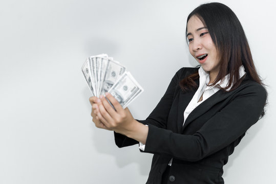 Happy Business Man With A Lot Of Dollar Money In Hand On White Background