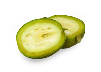 Green walnut halves isolated on white background