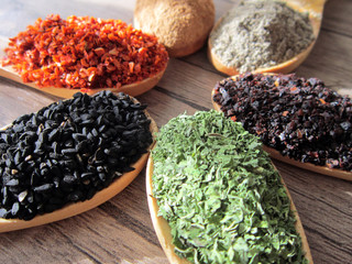 spices in wooden spoons.food,cooking.aroma. 