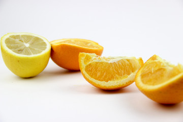 fresh fruits. Lemons and oranges sliced and whole