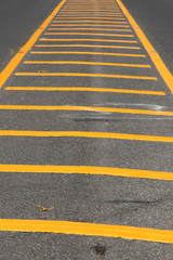 Yellow color road line on asphalt background