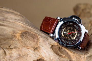 Close up of Luxury man wrist watches placed on timber in brown background