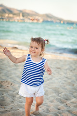 Cute girl on a beach on sunset. Mallorca, Spain