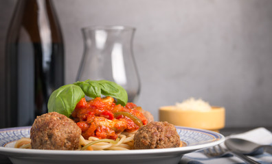 Spaghetti with meatballs and wine.
