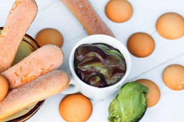 Chocolate and pistachio mousse, biscuits.