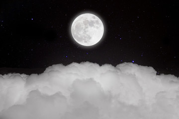 Romantic night. Full moon in space over stars with cloudscape .