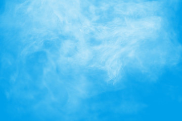Fototapeta na wymiar White smoke on blue background.