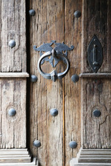 Background with wooden old Gothic door and door handle