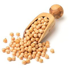 dried chickpeas in the olive wood scoop, isolated on white