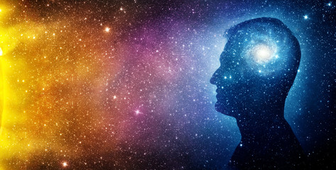 The universe within. Silhouette of a man inside the universe. The concept on scientific and philosophical topics.  Elements of this image furnished by NASA.