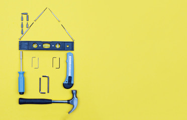 Selection of tools in the shape of a house.