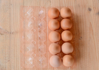 Eggs on wooden background.