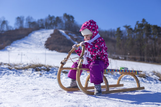 Little girl enjoying a sleigh ride