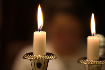 Burning candles on a blurred background