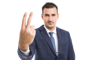 Businessman showing number two with fingers.
