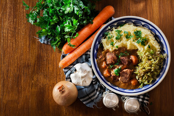 Traditional irish stew served with potatoes and cabbage