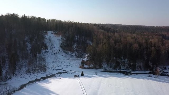 Winter walk along river drone