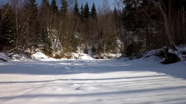 Winter walk along river drone