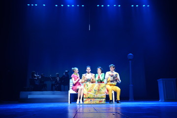 Young actors and Actresses dance on the stage of the theater