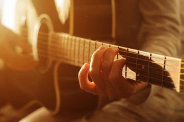playing acoustic guitar