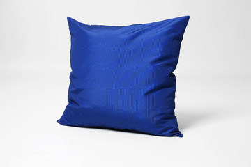 Soft decorative pillow on light background