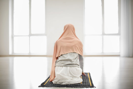 Young Muslim Woman Praying, Indoors