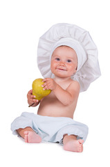 Cheerful little child with a pear in his hands in a chef suit on a white background.