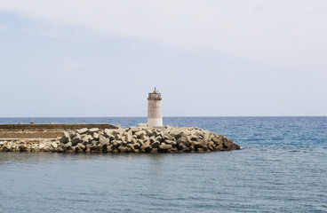 Photo of a lighthouse on a cloudless horizon