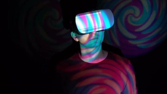 Man using VR-glasses in the spotlight