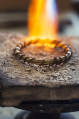 Craft jewelery making with flame torch