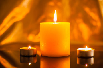 Single lit candles.Candles new year.