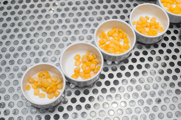 Sweetcorn in white bowl.