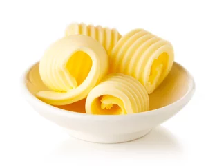 Rolgordijnen Butter curls isolated on white background © bigacis