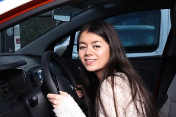 Fototapeta na wymiar Asian woman in a car