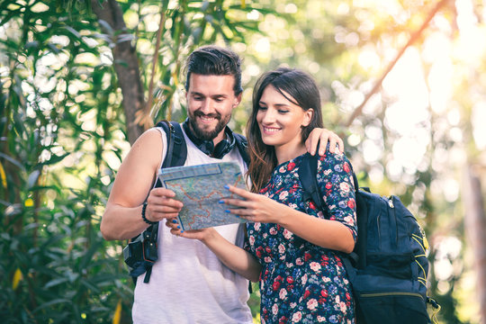 Young tourist couple travel holiday with map