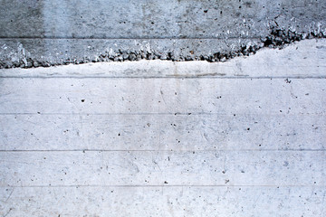 Closeup fragment of grunge concrete wall of a building