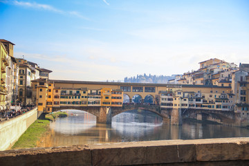 Naklejka premium Cityscape with the Ponte Vecchio bridge over the Arno river in Florence, Tuscany, Italy
