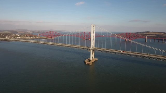 Aerial footage of the old Forth Road Bridge and the Railway Bridge.