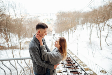 Couple spend time with each other, stand on the street and kiss