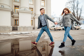 Couple spend time with each other, stand on the street and kiss