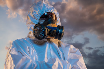 air contaminated by pollution, man with mask and protective suit, concept of biological diseases and environmental problems