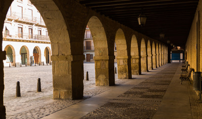 The porticos of a plaza in Puente la Reina, Spain