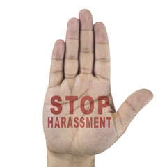 Stop harassment words written on male's hand. Isolated on white background