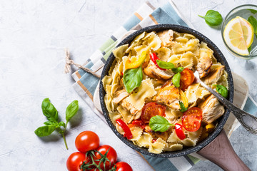 Pasta with chicken and vegetables top view.
